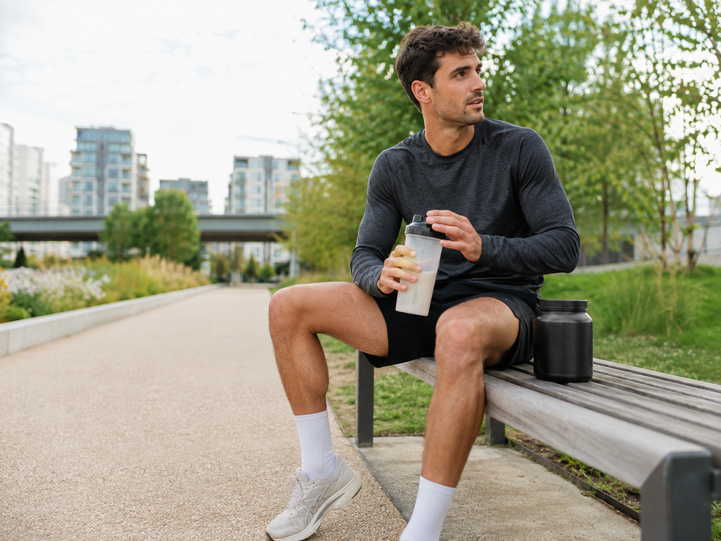 Runner taking a performance drink during a training break